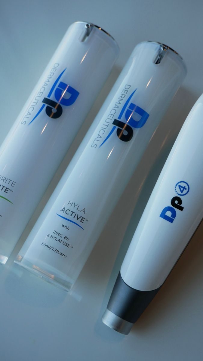 Dp Dermaceuticals skincare beside a Dermapen 4 device